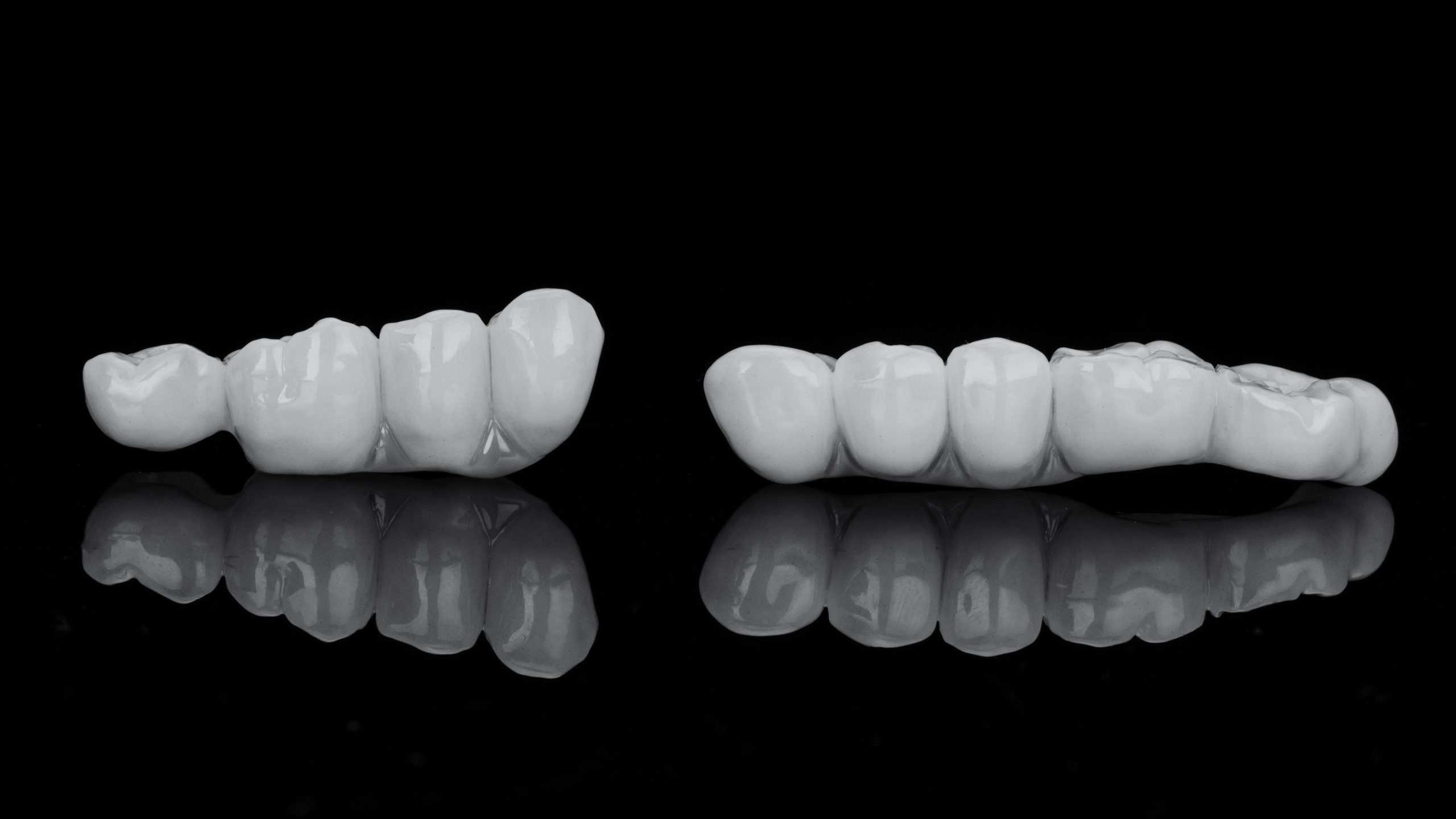 two dental bridges for the restoration of chewing teeth, photo in black and white style