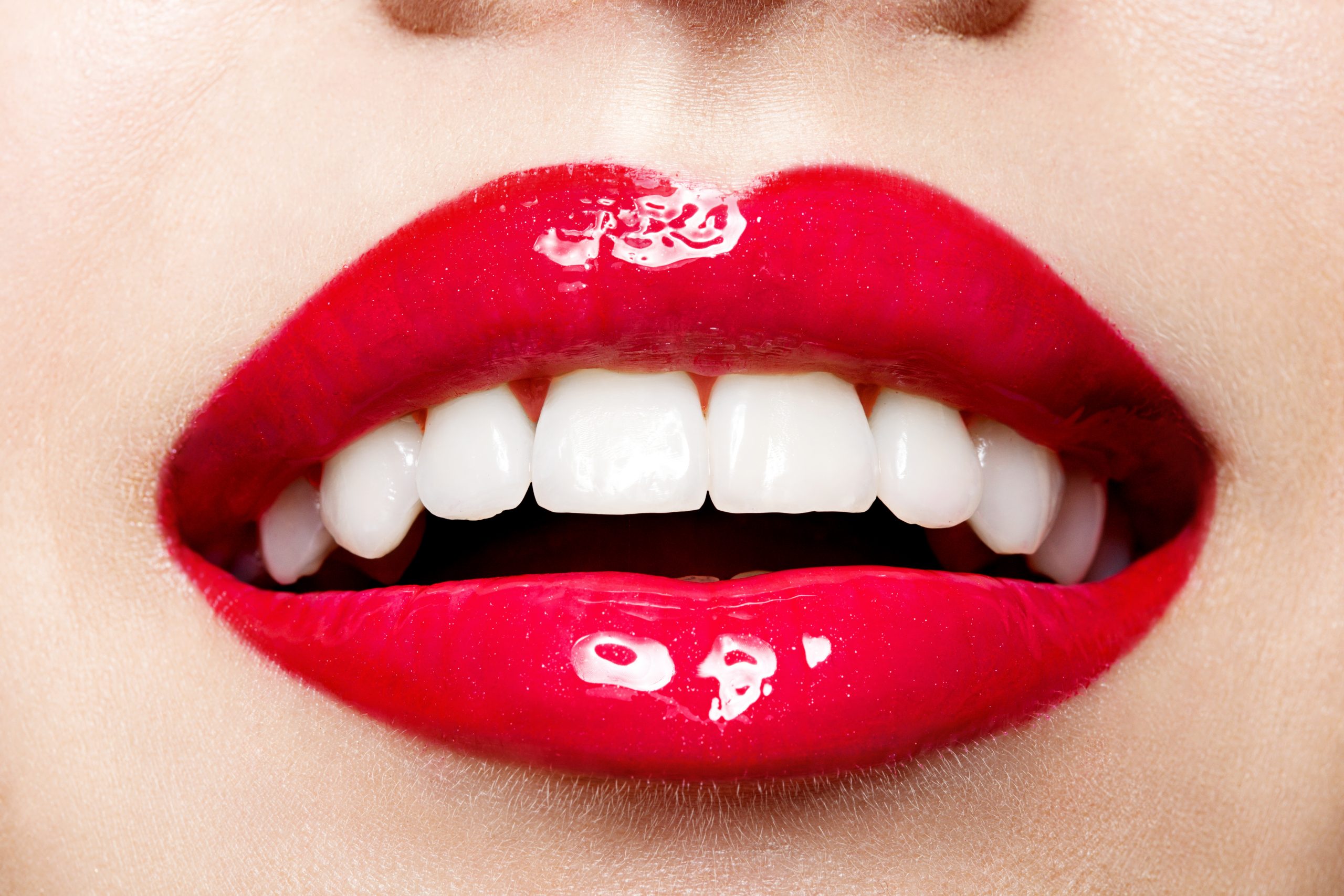 Beautiful women smile with red lips and white teeth